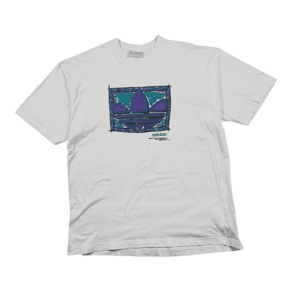 Digg It Thrift & Vintage white 90s Adidas t-shirt featuring a hand-drawn purple and teal Trefoil logo graphic.