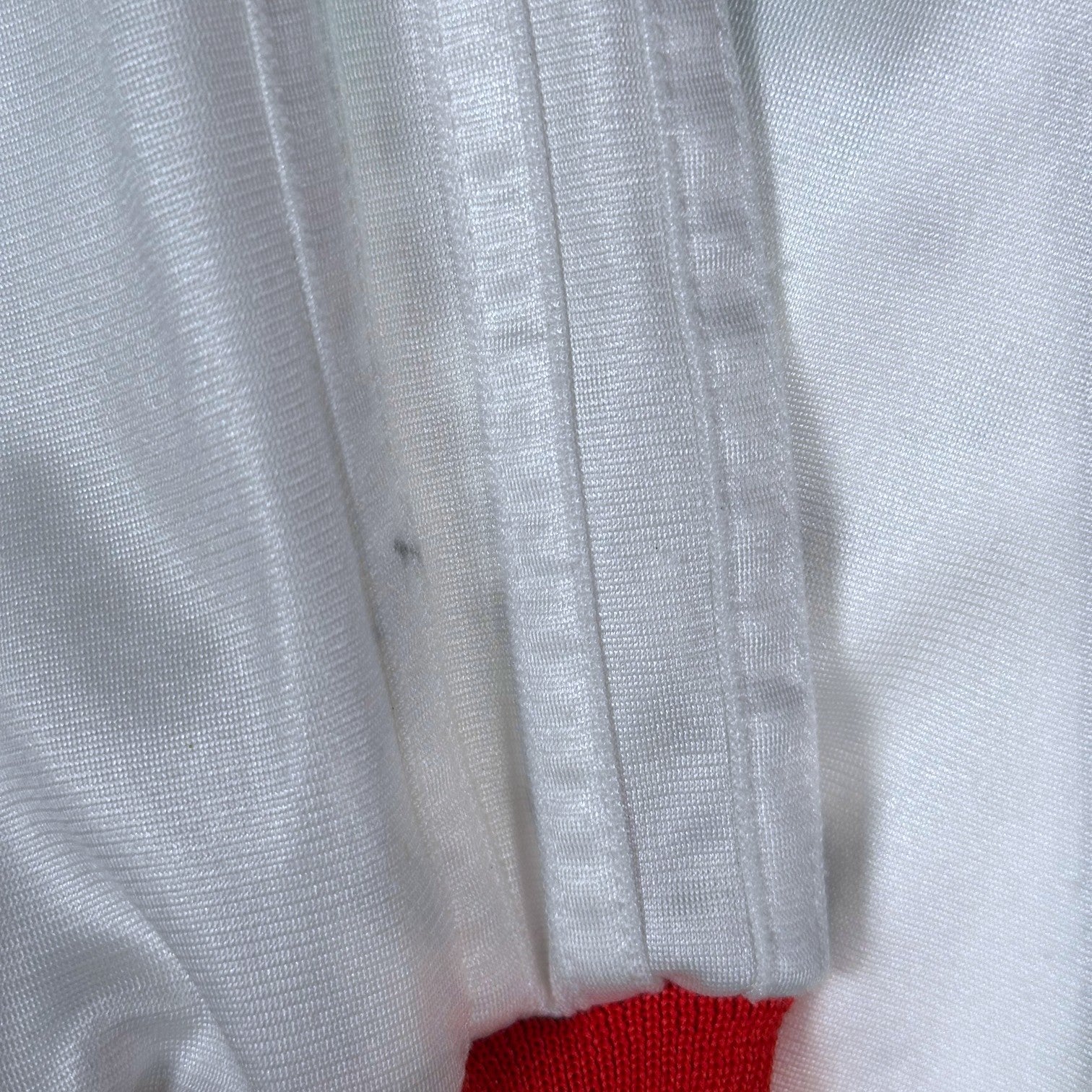Digg It Thrift & Vintage white Adidas track jacket sleeve detail showing light staining on the fabric