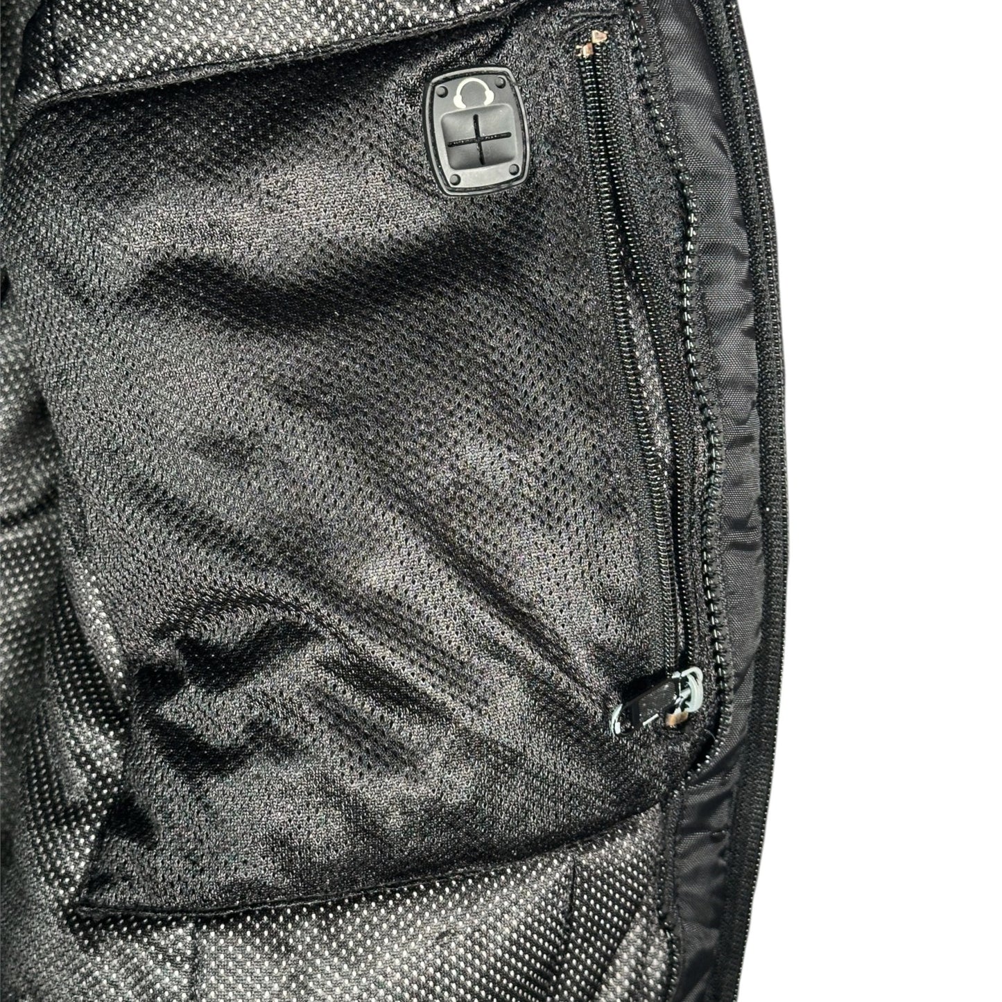 Digg It Thrift & Vintage Arctic Cat snowmobile jacket interior black mesh pocket with zipper and headphone port