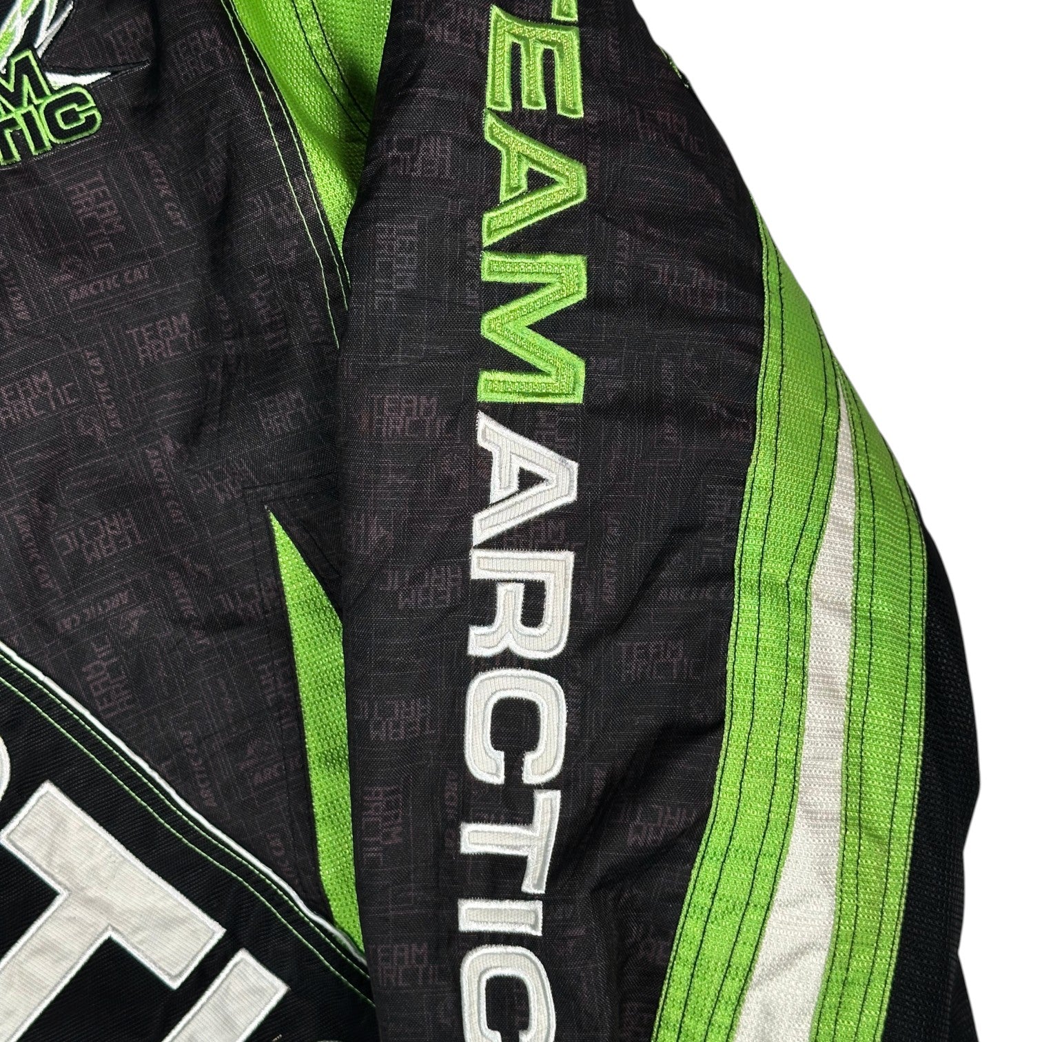 Digg It Thrift & Vintage Arctic Cat Team Arctic snowmobile racing jacket sleeve with green and black branding
