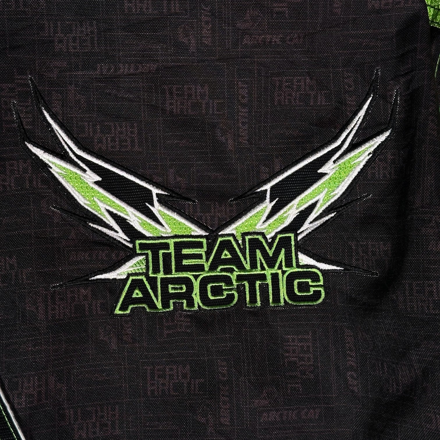 Digg It Thrift & Vintage Arctic Cat Team Arctic TriBalance snowmobile racing jacket with green and black embroidery.