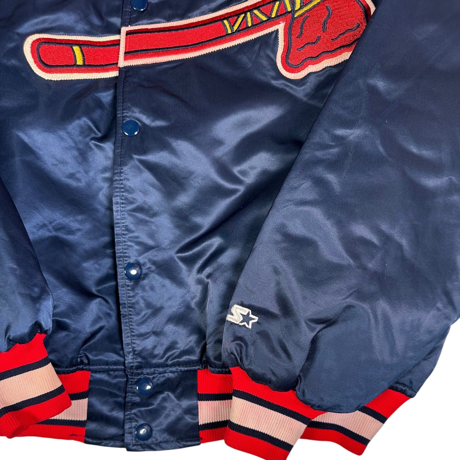Digg It Thrift & Vintage navy blue Starter Atlanta Braves satin bomber jacket with red and white striped cuffs