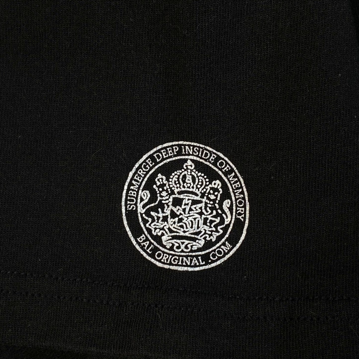 Digg It Thrift & Vintage black Stüssy x BAL Original t-shirt featuring a white circular graphic logo print