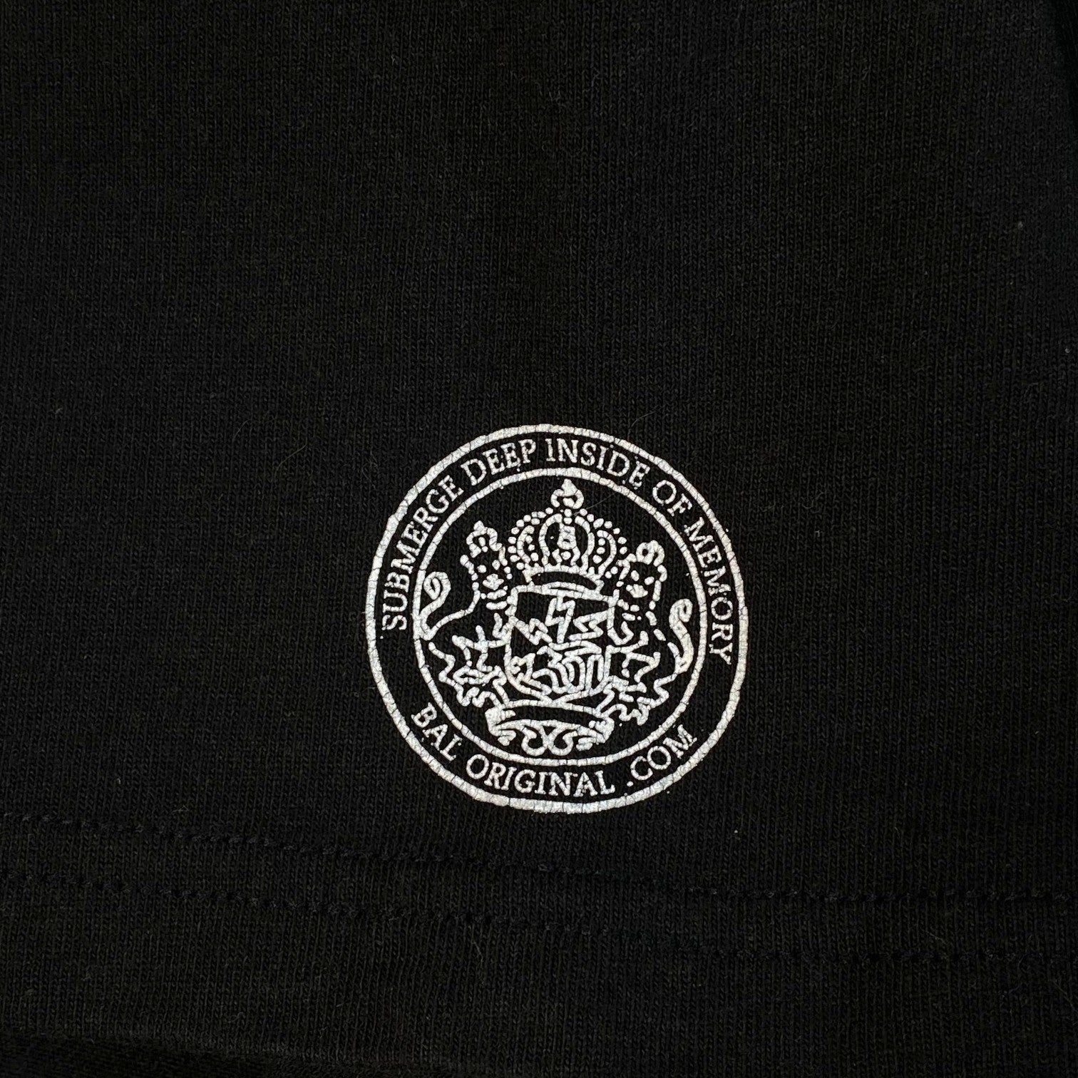 Digg It Thrift & Vintage black Stüssy x BAL Original t-shirt featuring a white circular graphic logo print
