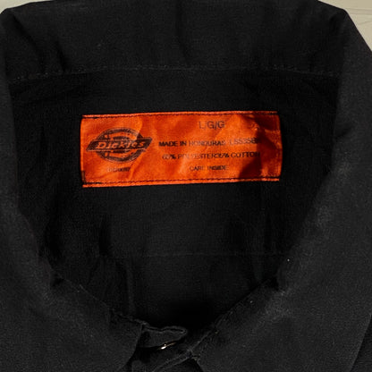 Digg It Thrift & Vintage black Dickies work shirt with orange neck label, size large, polyester cotton blend