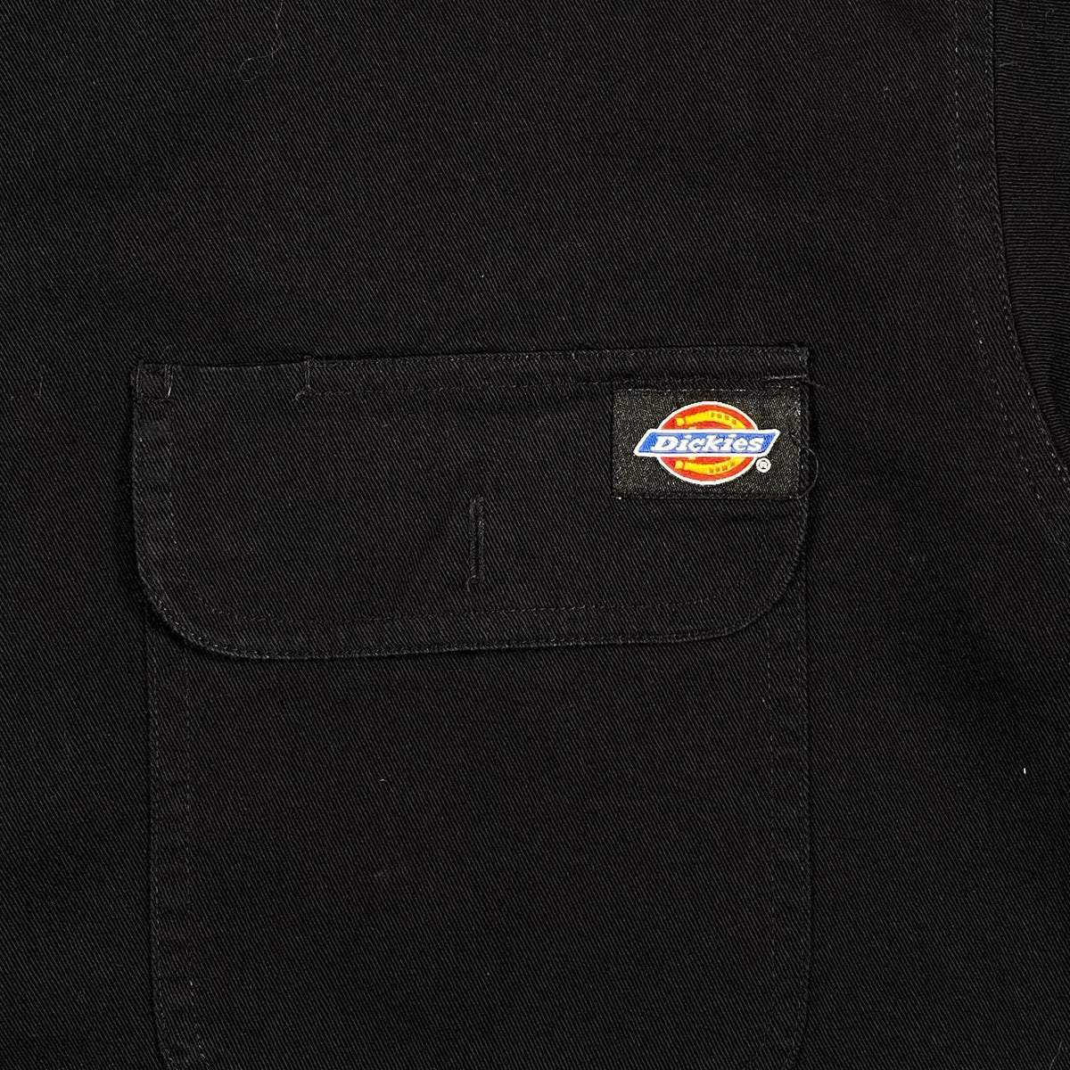 Digg It Thrift & Vintage black Dickies work shirt featuring a chest pocket with the iconic Dickies logo patch