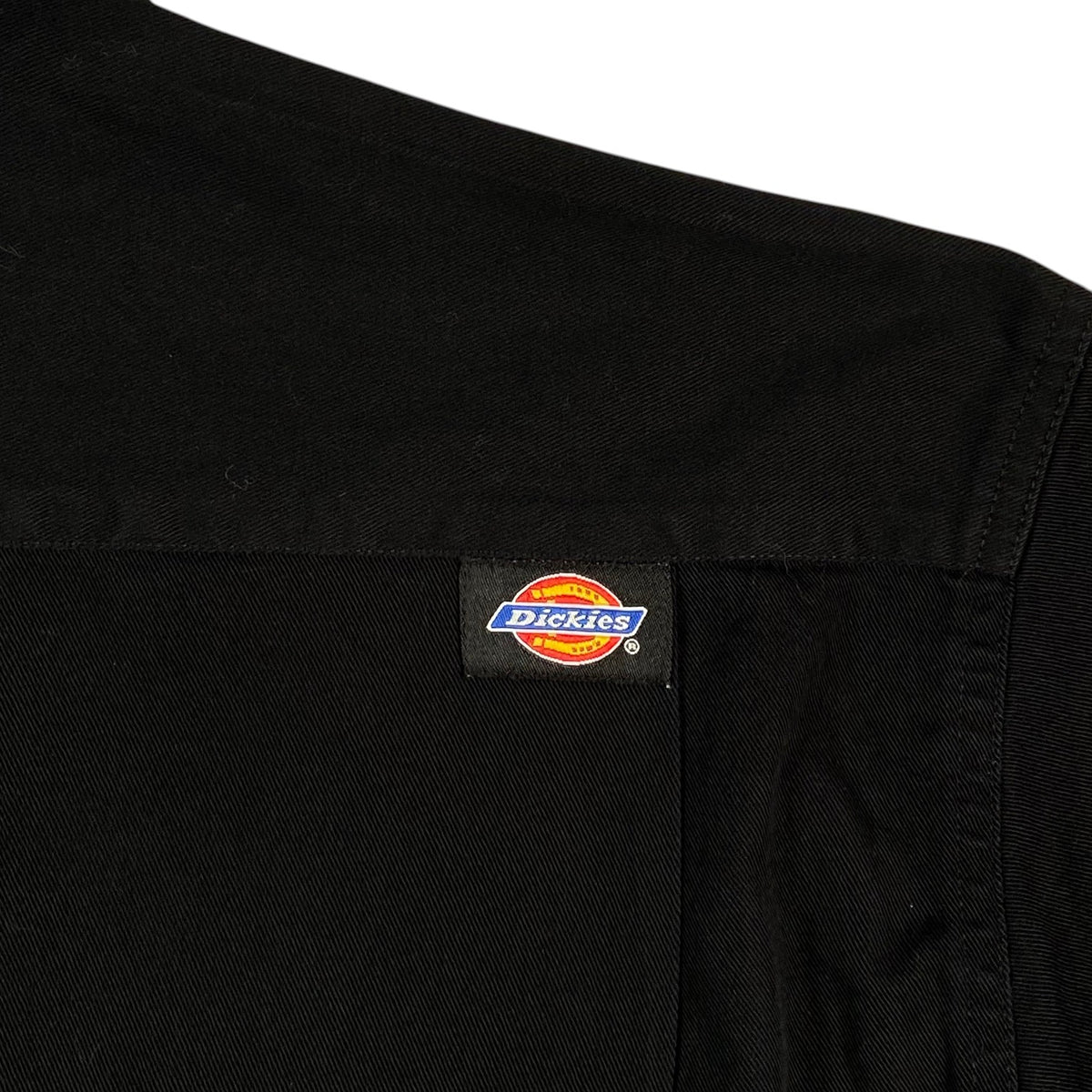 Digg It Thrift & Vintage black Dickies work shirt with iconic logo patch on the shoulder