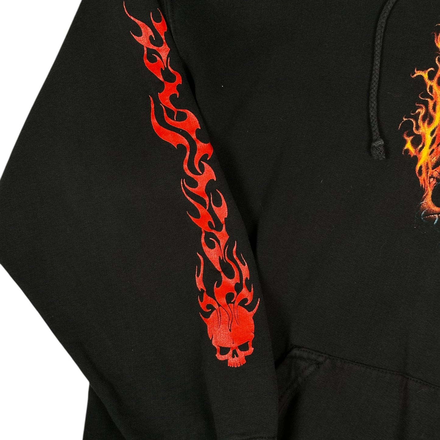 Digg It Thrift & Vintage black pullover hoodie featuring a red flame and skull graphic print on the sleeve