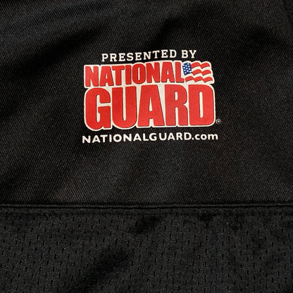 Digg It Thrift & Vintage black mesh NFL H.S.P.D. practice jersey featuring a National Guard logo print