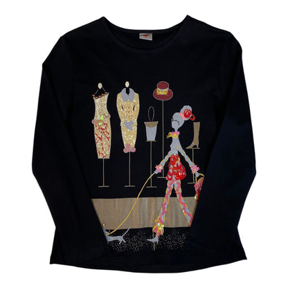 Digg It Thrift & Vintage black long sleeve top featuring a whimsical fashion runway graphic with embellished details.