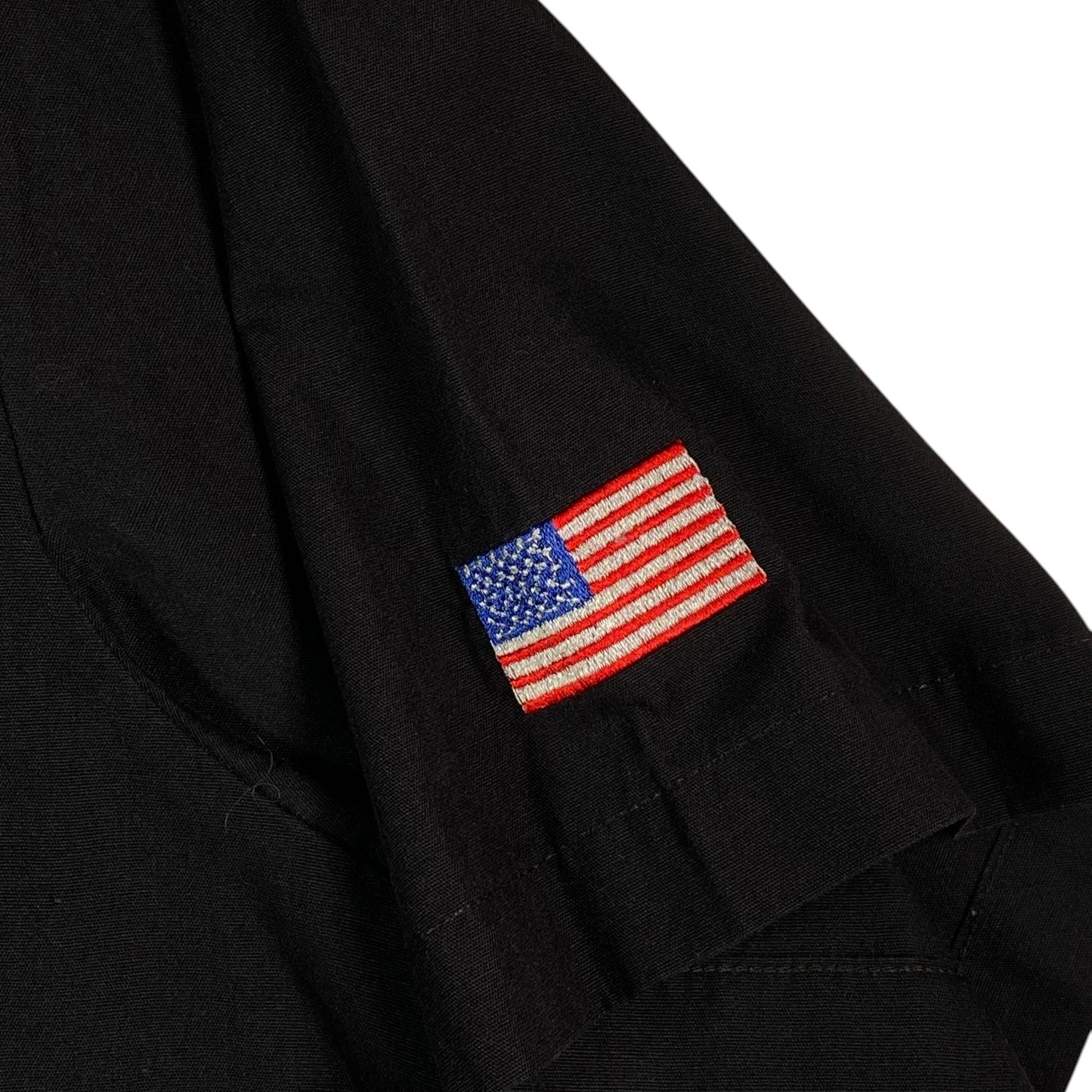 Digg It Thrift & Vintage black short sleeve work shirt with embroidered American flag patch on the sleeve
