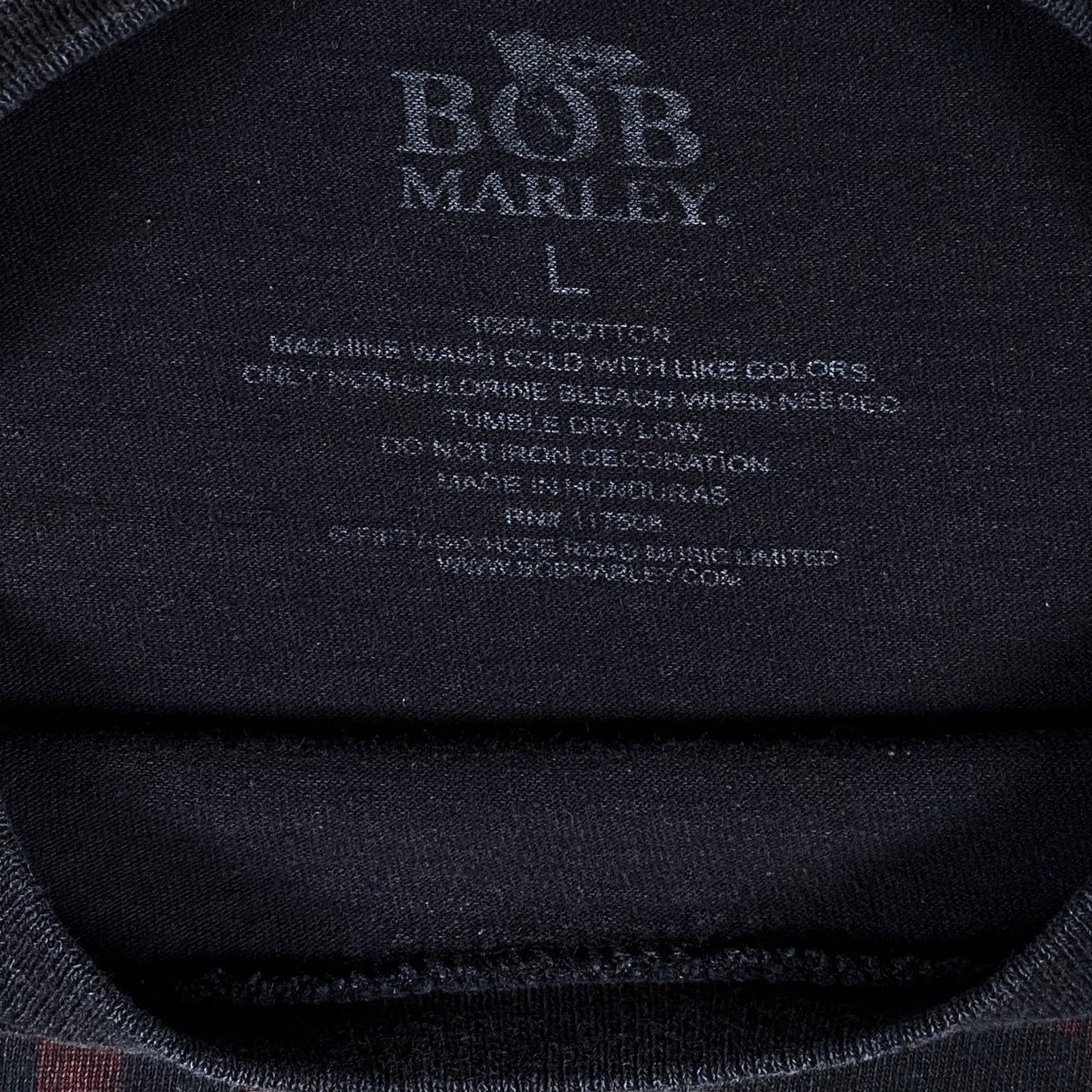 Digg It Thrift & Vintage black Bob Marley music t-shirt interior neck label with size large and care instructions