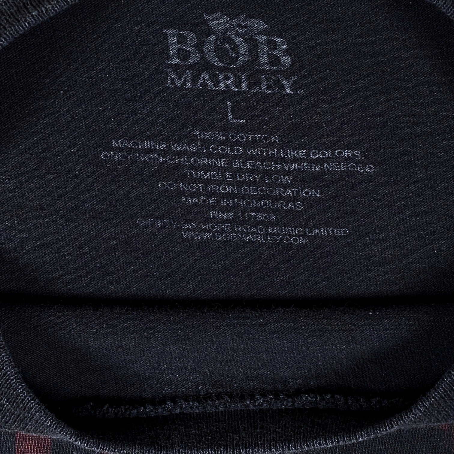 Digg It Thrift & Vintage black Bob Marley music t-shirt interior neck label with size large and care instructions