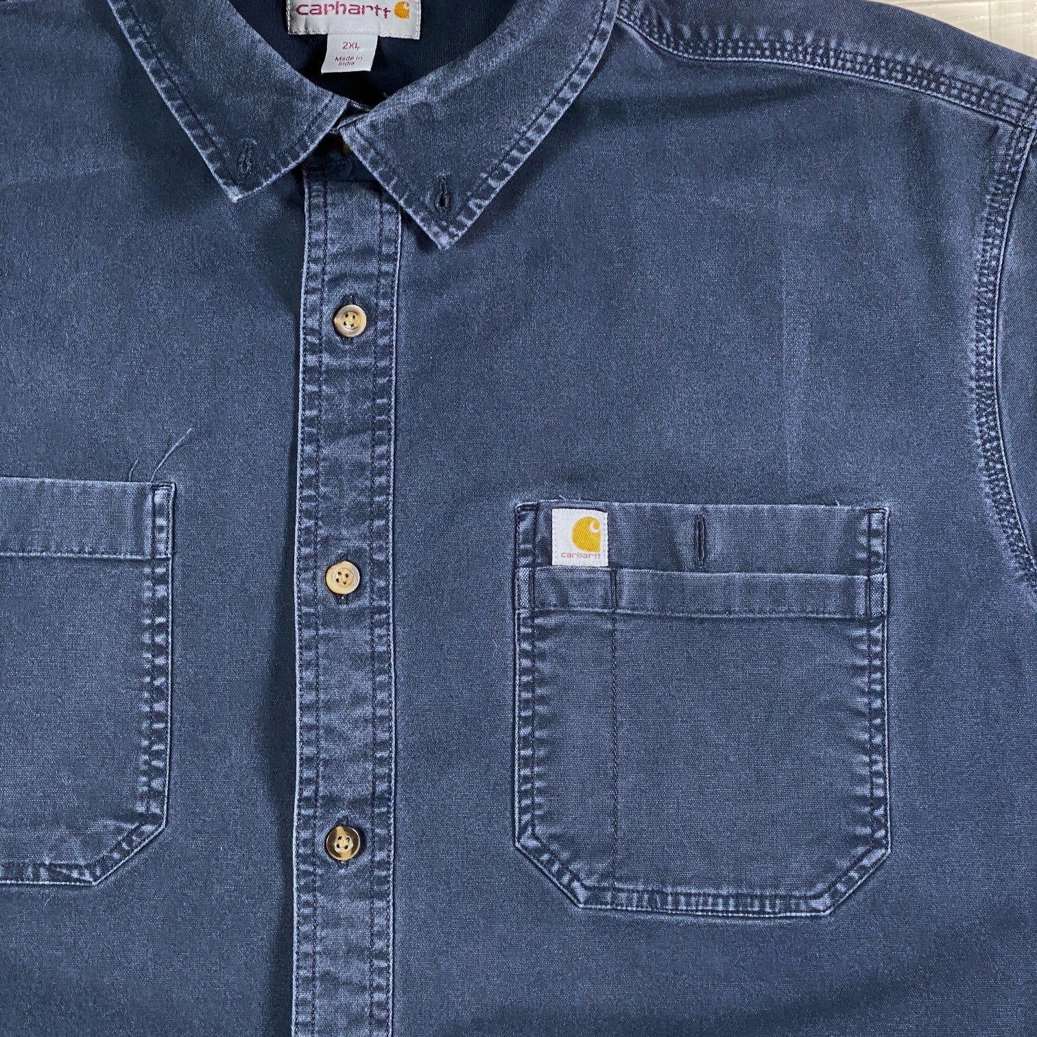 Digg It Thrift & Vintage blue Carhartt short sleeve work shirt with dual chest pockets and button-down collar