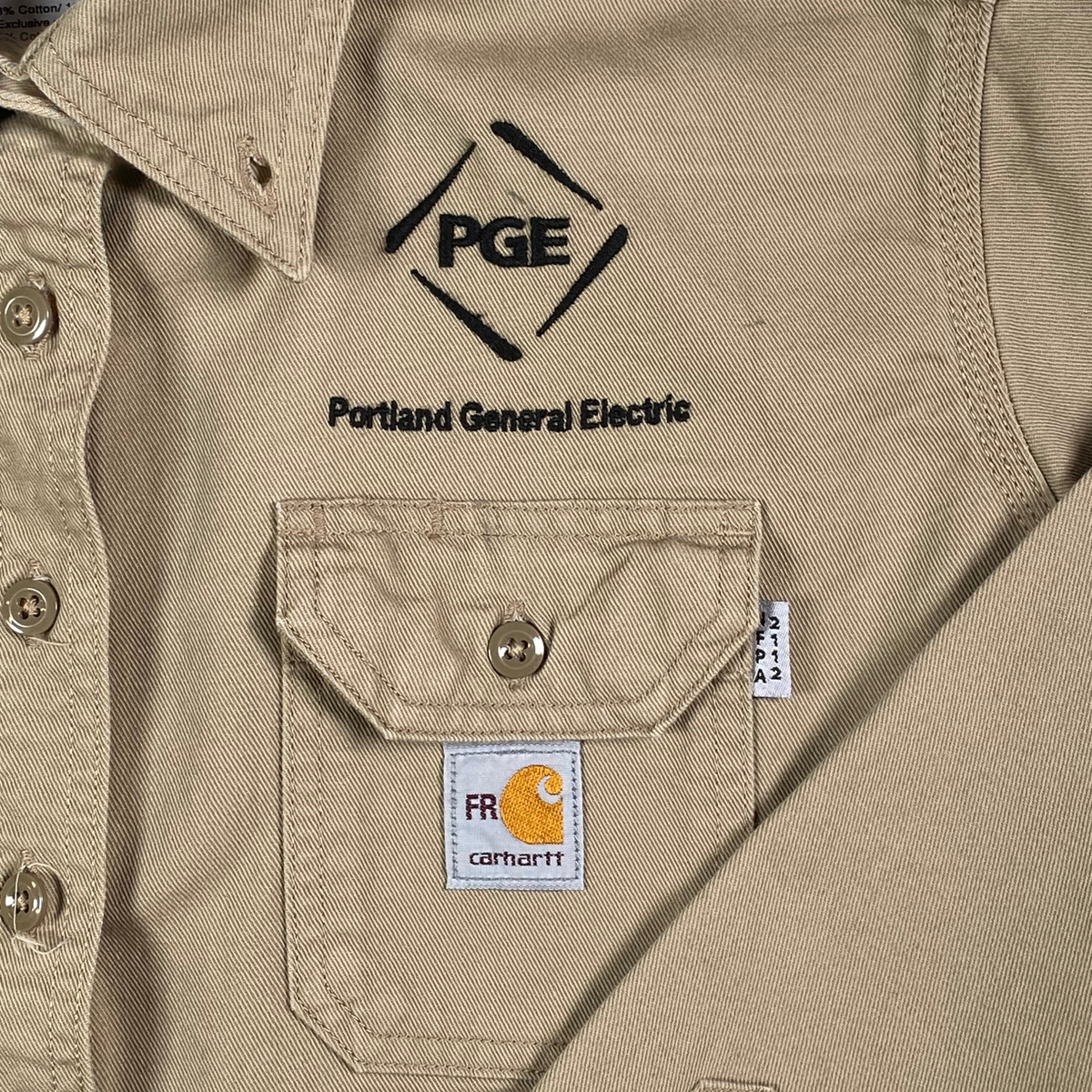 Digg It Thrift & Vintage Carhartt tan flame resistant canvas work shirt with Portland General Electric logo embroidery