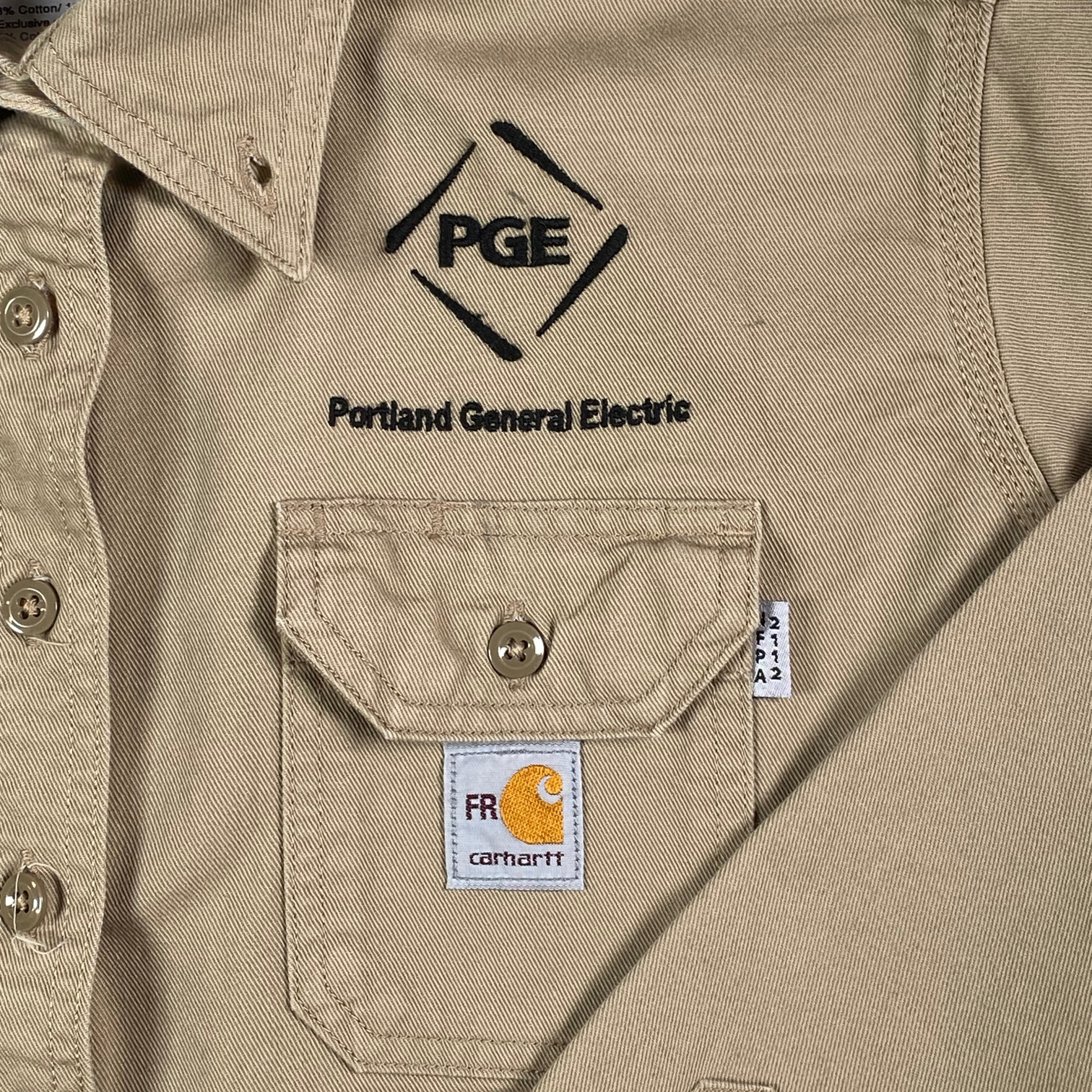 Digg It Thrift & Vintage Carhartt tan flame resistant canvas work shirt with Portland General Electric logo embroidery