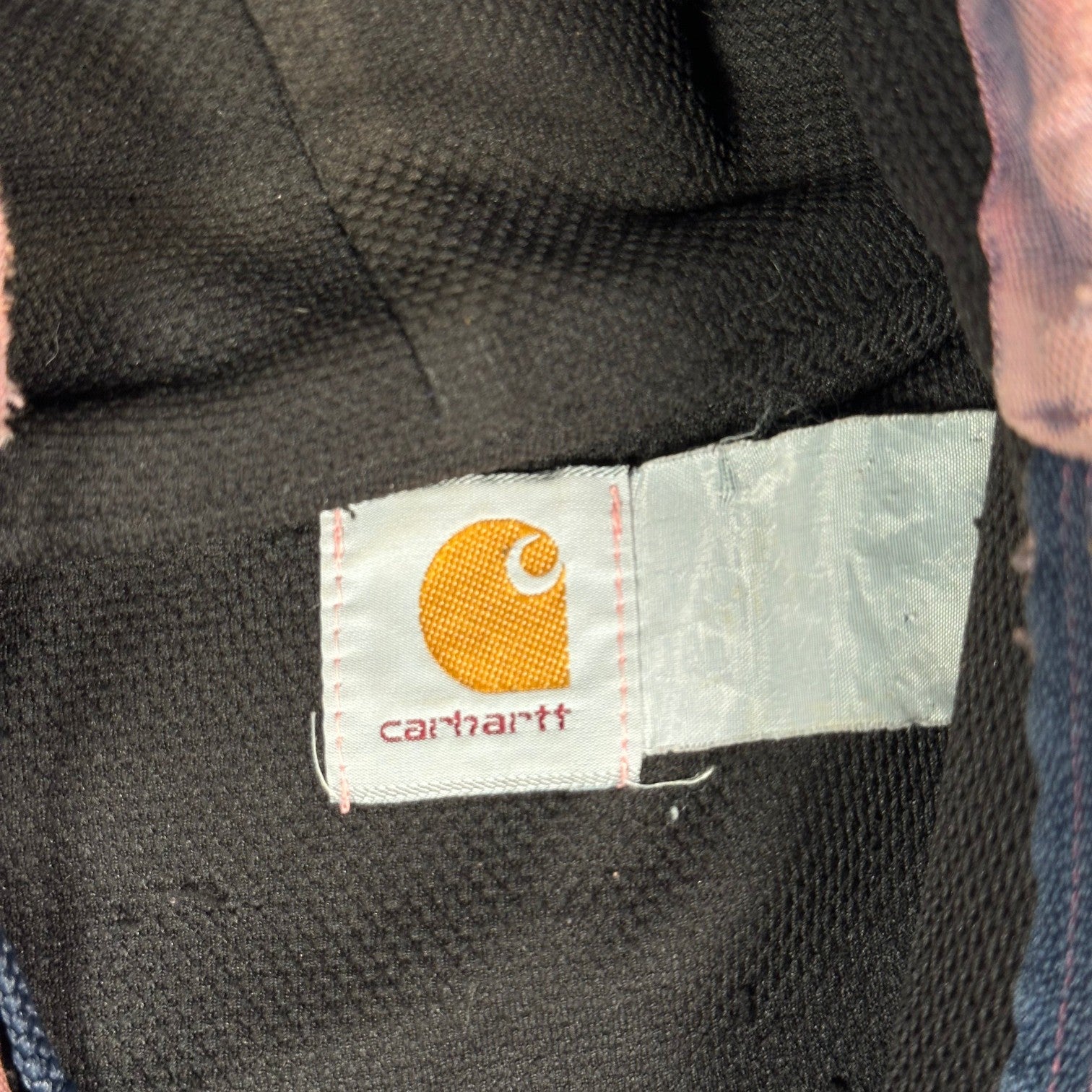 Digg It Thrift & Vintage Carhartt logo tag on a pink acid wash duck canvas active jacket interior