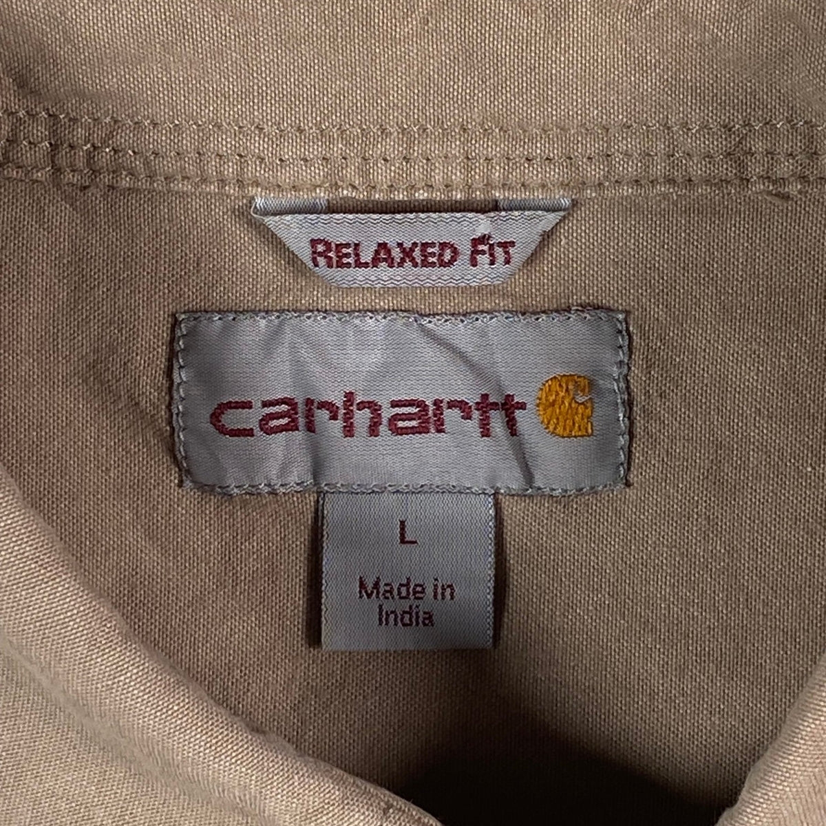 Digg It Thrift & Vintage Carhartt khaki canvas work shirt label showing relaxed fit and size large