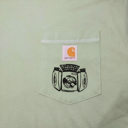 Digg It Thrift & Vintage light green Carhartt t-shirt with graphic print of a fan and Carhartt logo patch.