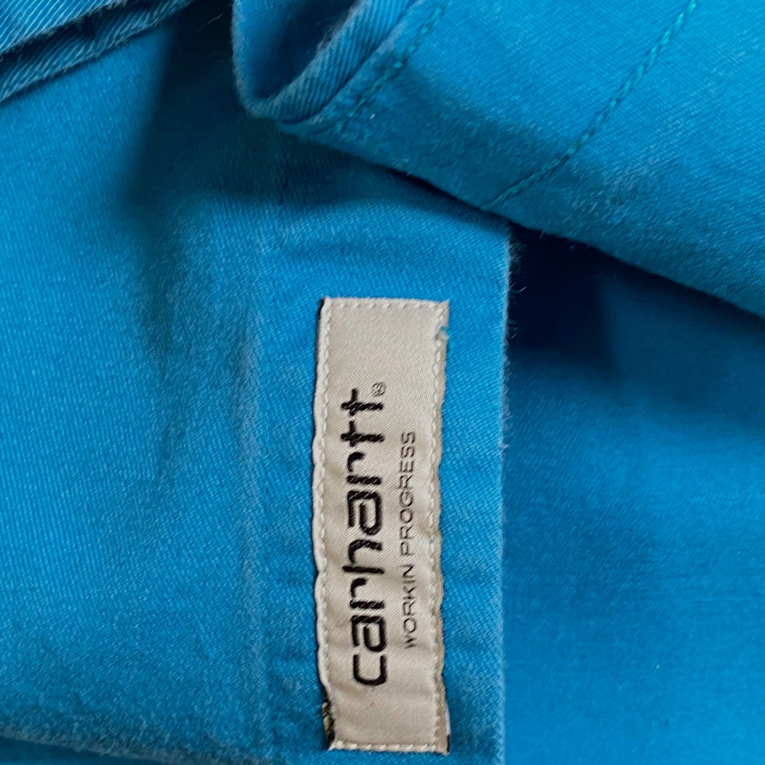 Digg It Thrift & Vintage Carhartt WIP long sleeve shirt in vibrant cyan blue with brand label detail