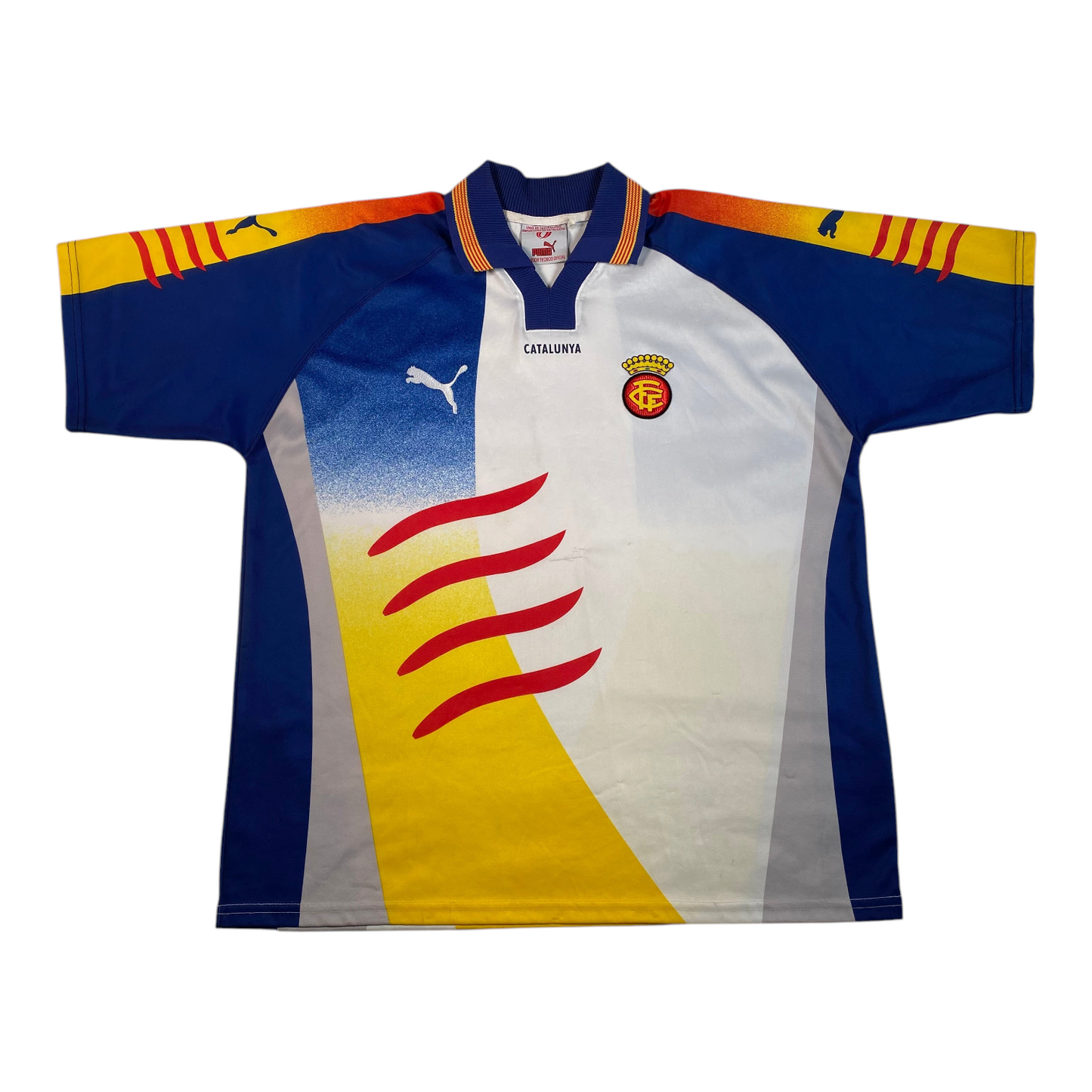 Digg It Thrift & Vintage 1999-2000 Catalunya national team football shirt in blue, white, yellow, and red.