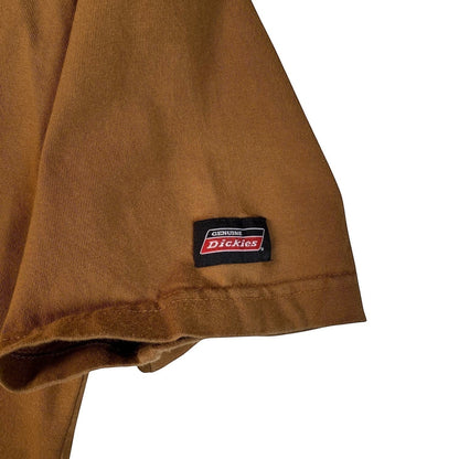 Digg It Thrift & Vintage beige Dickies t-shirt sleeve featuring the iconic red and white brand logo patch