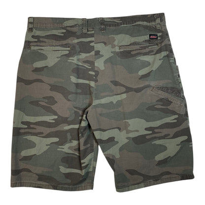 Digg It Thrift & Vintage Dickies woodland camo shorts featuring a classic utility design and back pocket logo tag.