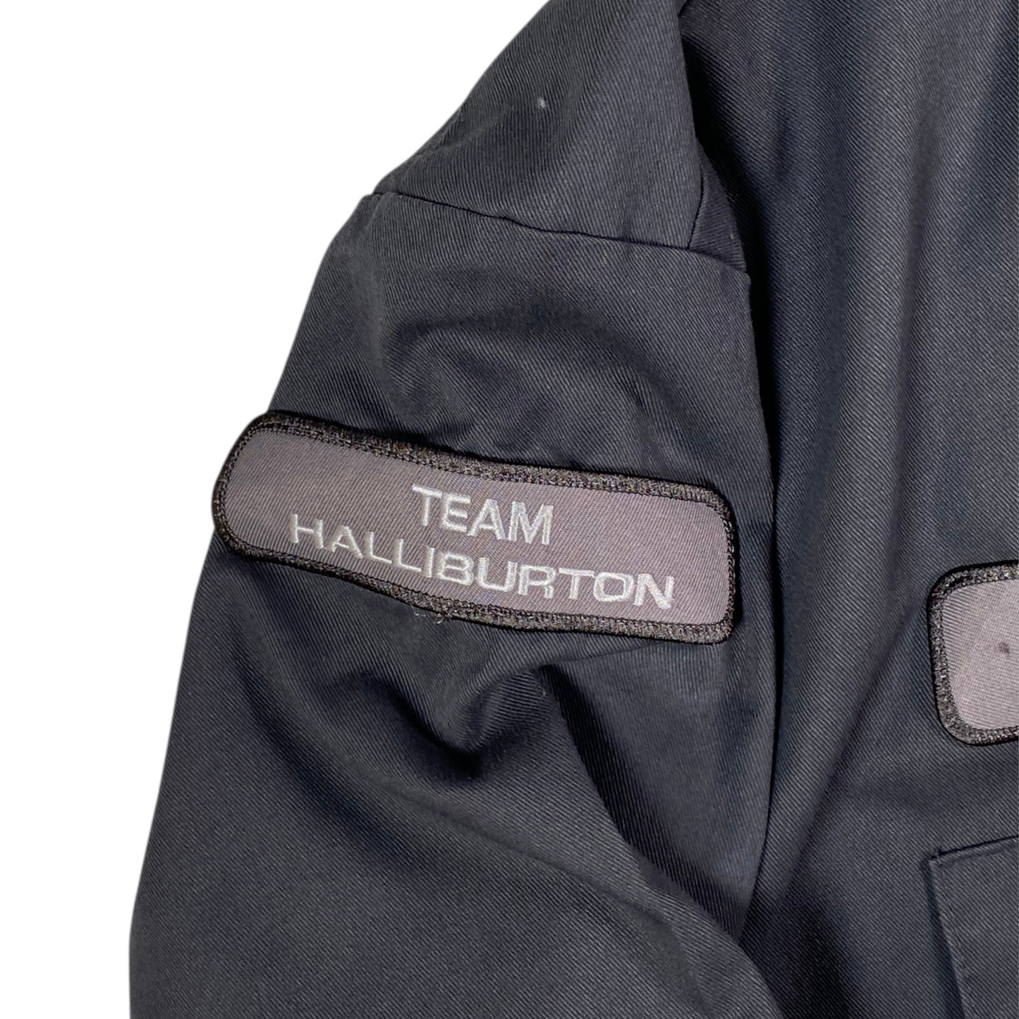 Digg It Thrift & Vintage gray Dickies work shirt featuring a Team Halliburton patch on the sleeve