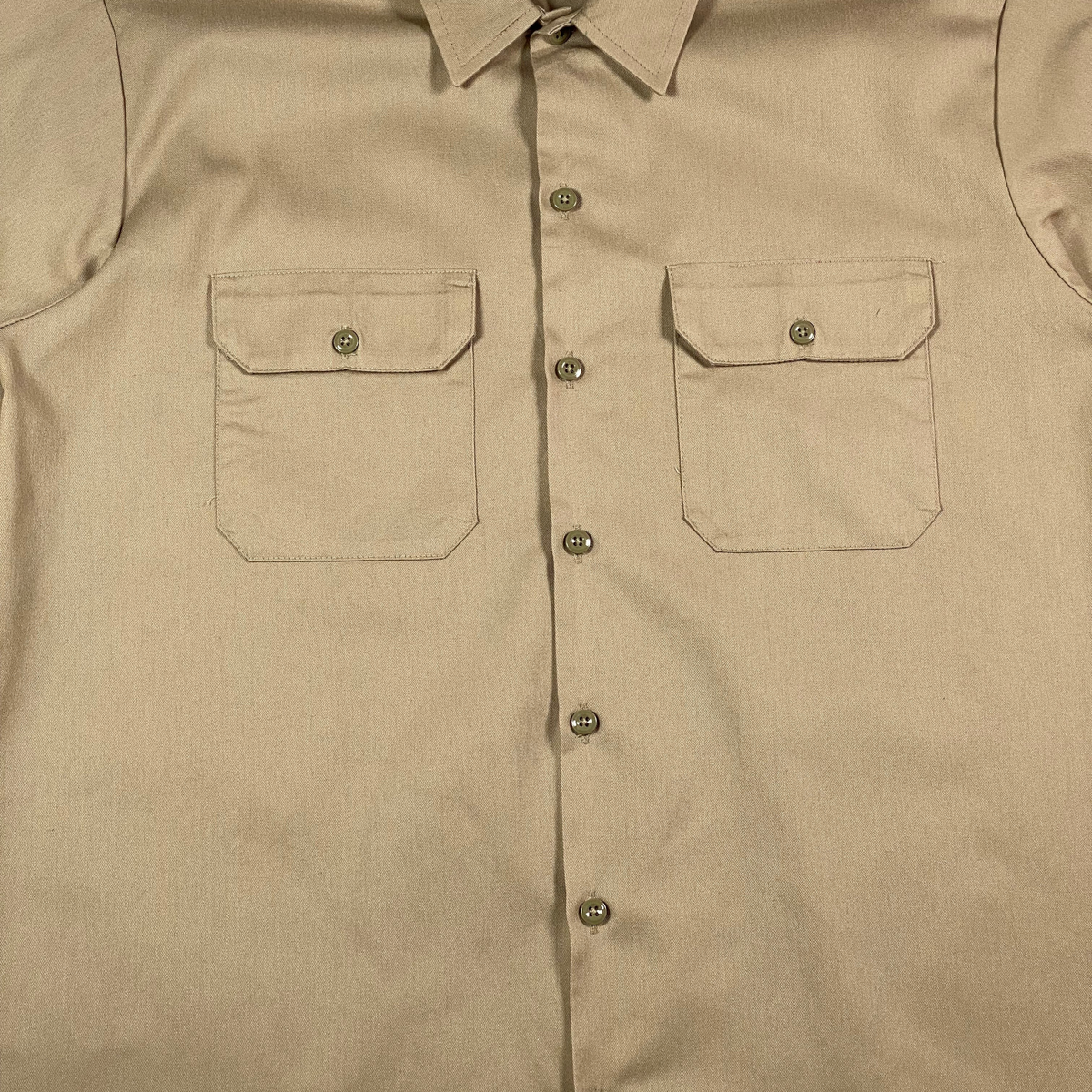 Digg It Thrift & Vintage Dickies desert sand khaki short sleeve work shirt with two chest pockets and button front.