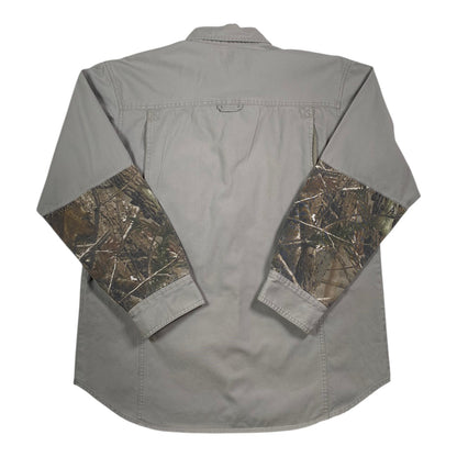 Back view of a Digg It Thrift & Vintage grey outdoor shooting shirt with Realtree camo sleeves and button cuffs.