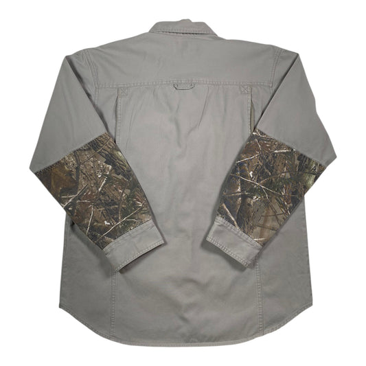 Back view of a Digg It Thrift & Vintage grey outdoor shooting shirt with Realtree camo sleeves and button cuffs.