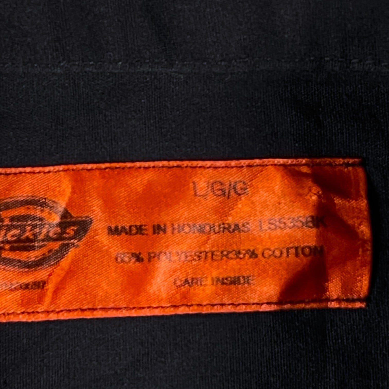 Digg It Thrift & Vintage Dickies black work shirt size large tag showing polyester cotton blend fabric details