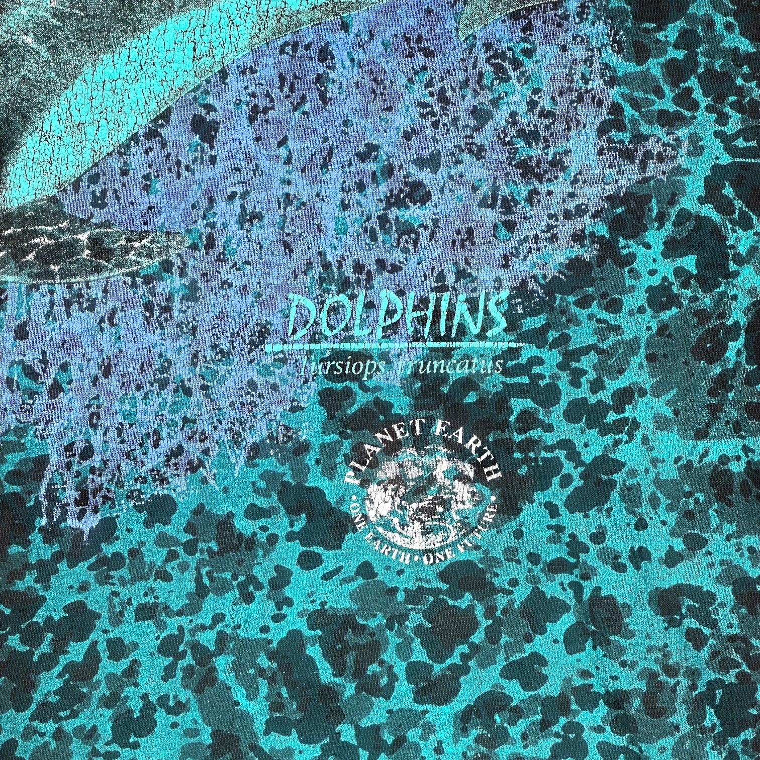 Digg It Thrift & Vintage vintage Churinga Designs t-shirt featuring a teal and blue dolphin planet earth graphic