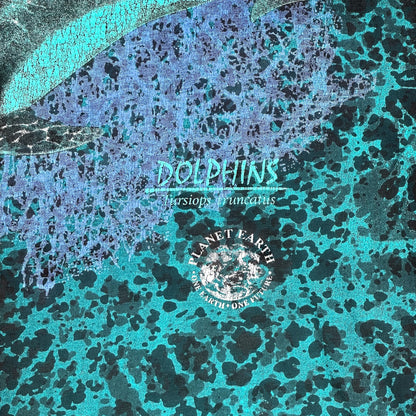 Digg It Thrift & Vintage vintage Churinga Designs t-shirt featuring a teal and blue dolphin planet earth graphic