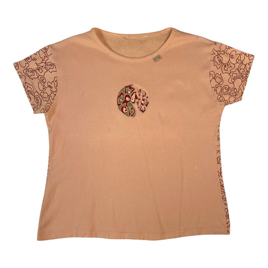Digg It Thrift & Vintage dusty pink short sleeve top featuring a central sequin medallion and patterned sleeve trim.