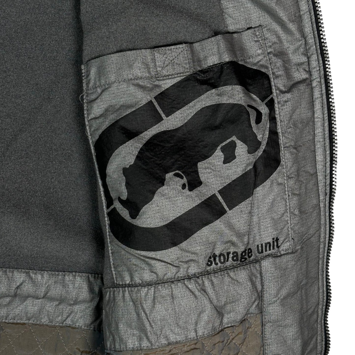 Digg It Thrift & Vintage black Ecko Unltd. winter jacket interior featuring a fleece lining and storage unit pocket