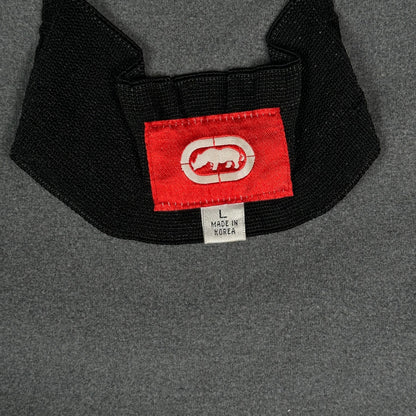 Digg It Thrift & Vintage Ecko Unltd. black fleece jacket neck label with red logo tag and size large label