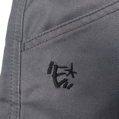 Digg It Thrift & Vintage Energie B-Boy grey denim jorts featuring a detailed black embroidered logo on the pocket.