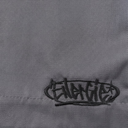 Digg It Thrift & Vintage grey denim fabric featuring black embroidered Energie logo detail on B-Boy hip hop jorts