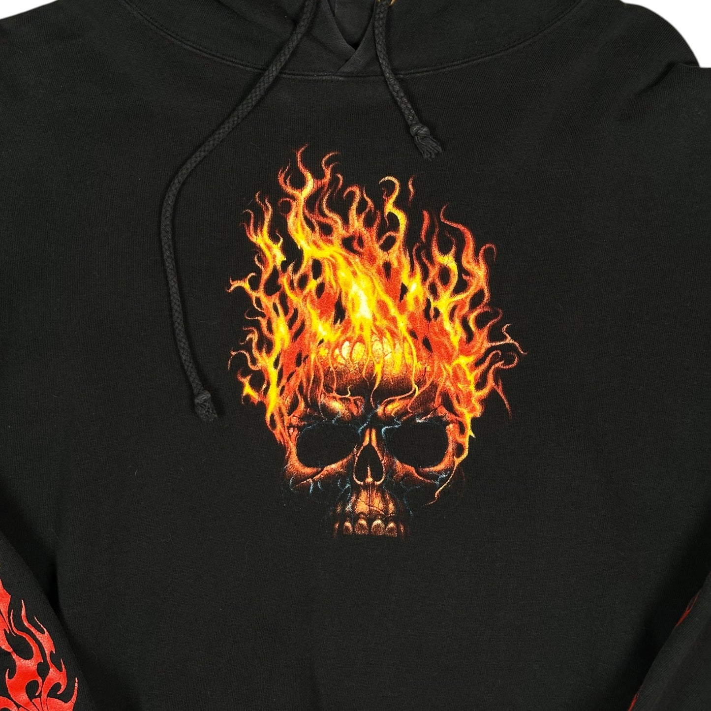 Digg It Thrift & Vintage black pullover hoodie featuring a vibrant flaming skull graphic print on the chest