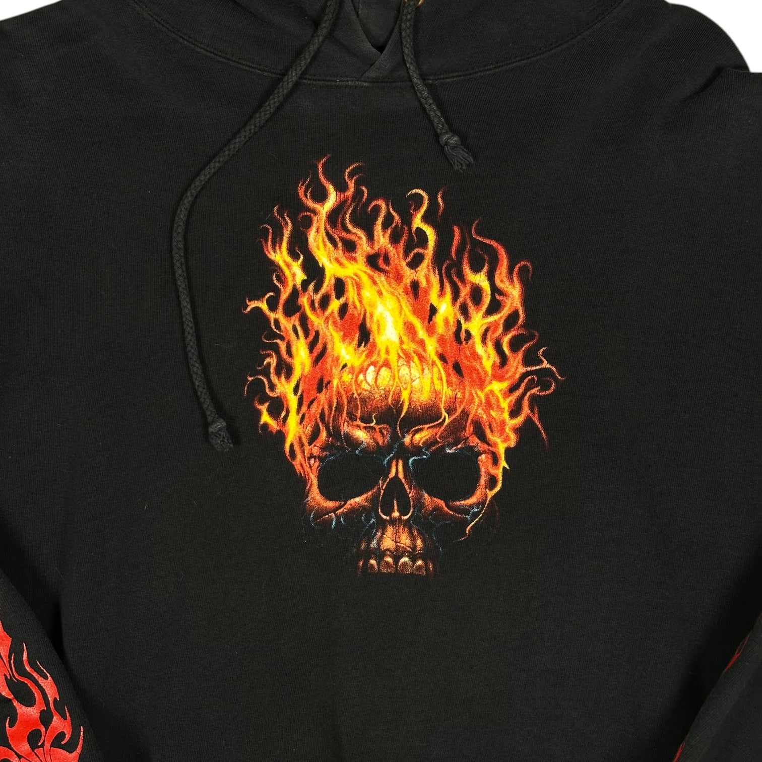 Digg It Thrift & Vintage black pullover hoodie featuring a vibrant flaming skull graphic print on the chest