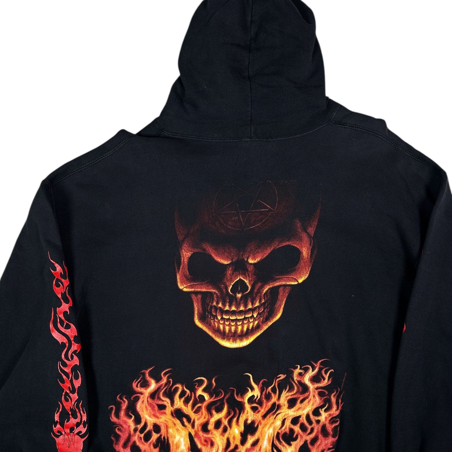 Digg It Thrift & Vintage black pullover hoodie featuring a large flaming skull graphic and red flame sleeve details.