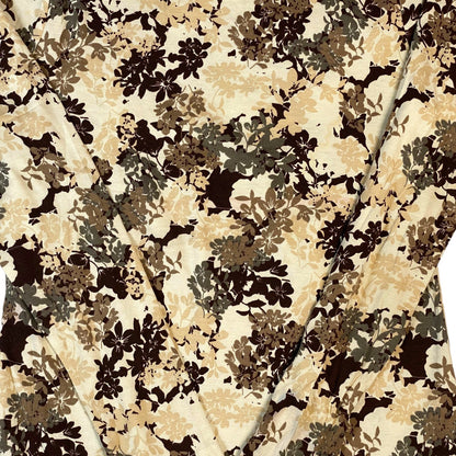 Digg It Thrift & Vintage White Stag long sleeve top featuring a brown and beige earth tone floral pattern
