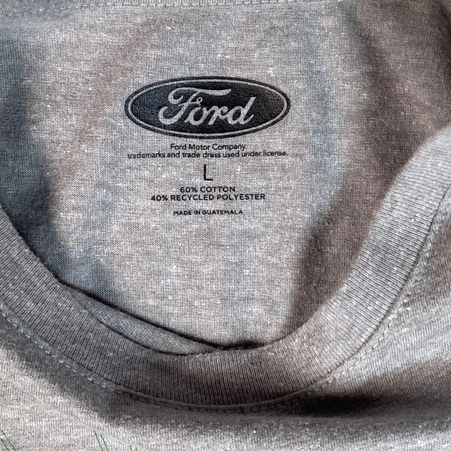 Digg It Thrift & Vintage heather grey Ford Bronco t-shirt neck label showing size large and cotton blend fabric