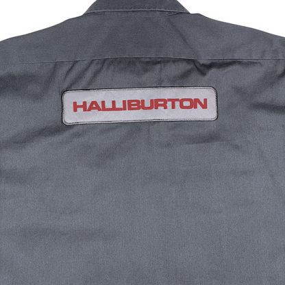 Digg It Thrift & Vintage gray Dickies work shirt featuring a Halliburton patch on the back