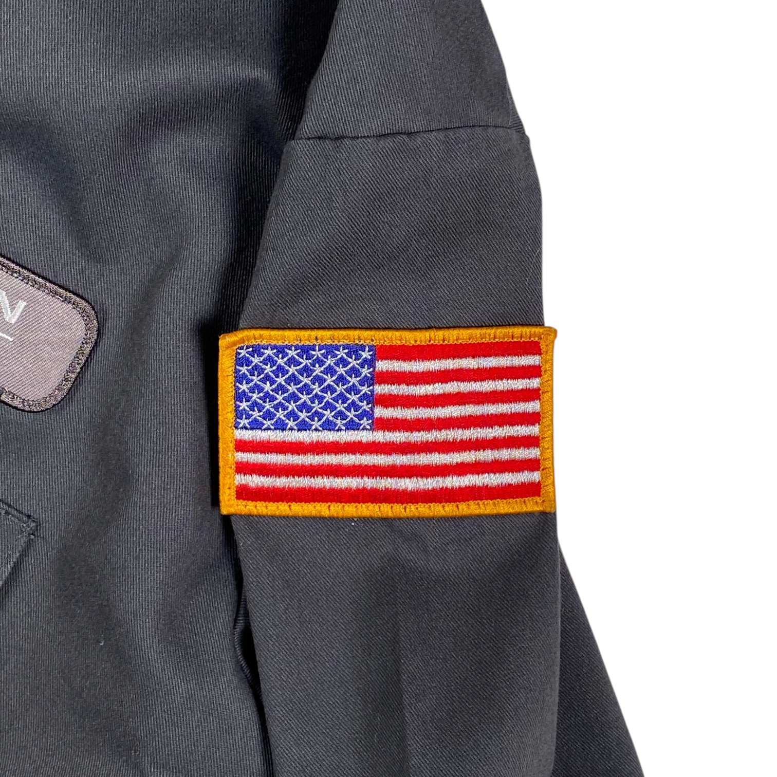 Digg It Thrift & Vintage gray short sleeve work shirt featuring an embroidered American flag patch on the sleeve