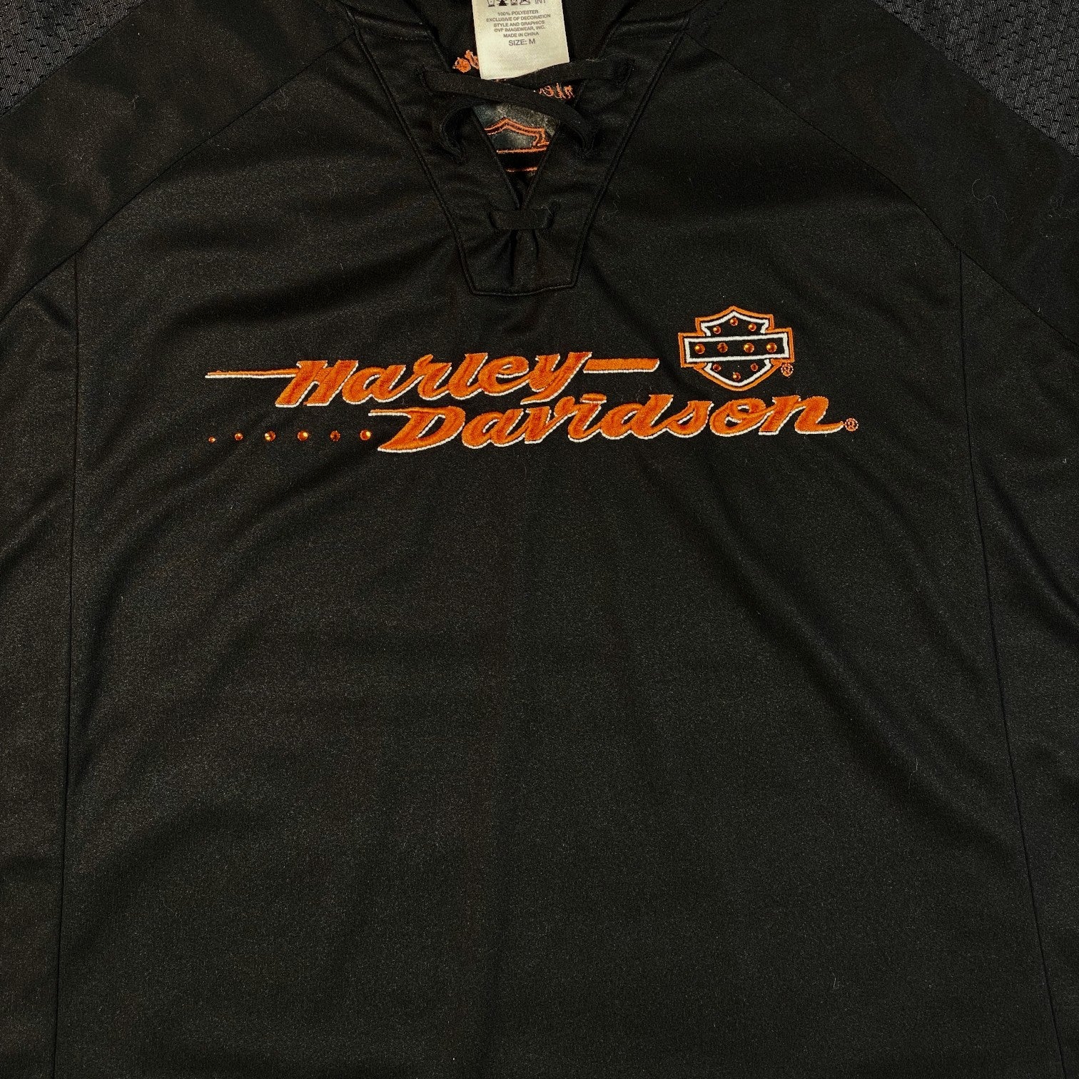 Digg It Thrift & Vintage black Harley-Davidson lace-up football jersey with orange embroidered logo