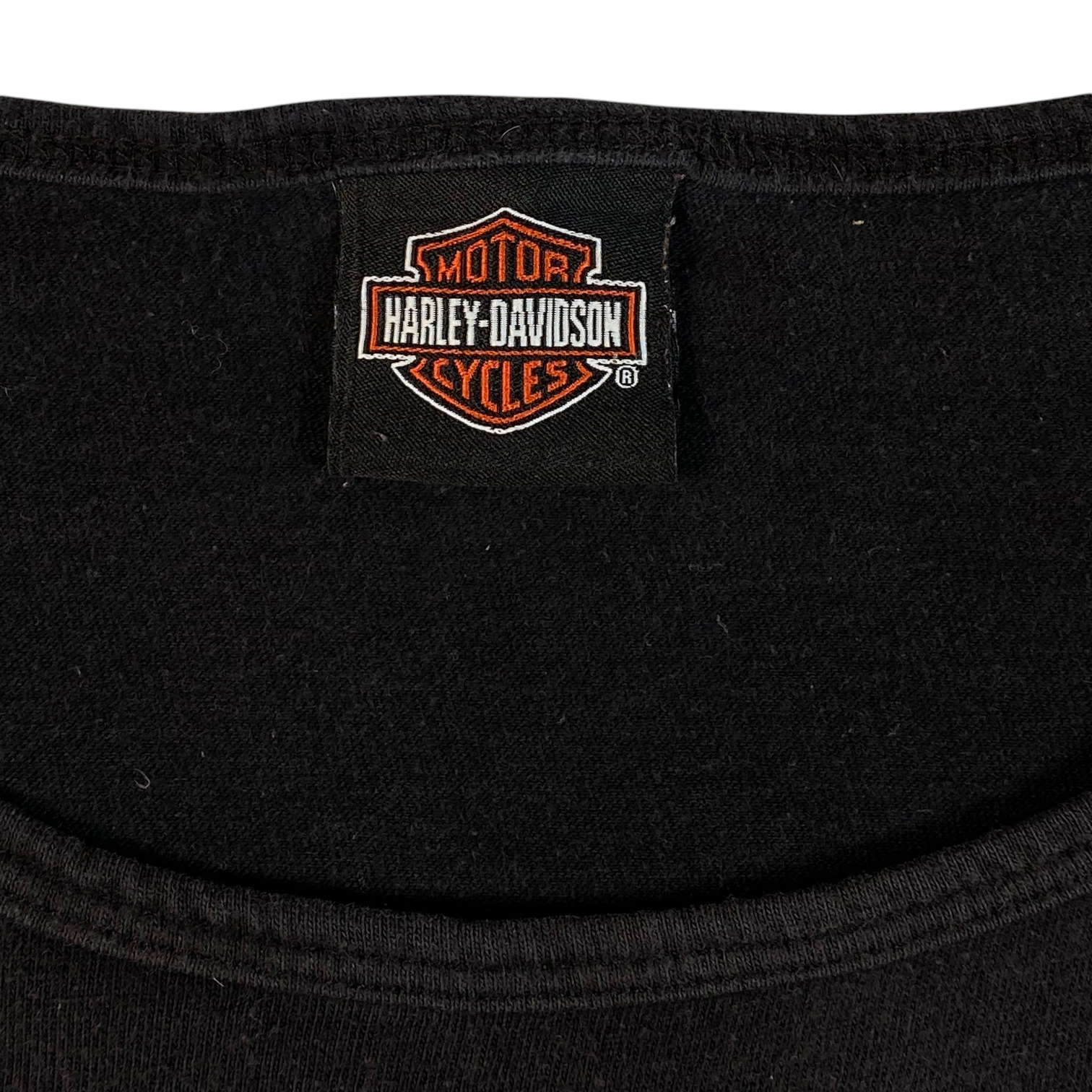 Digg It Thrift & Vintage black Harley-Davidson tank top featuring a classic orange and white brand logo neck label