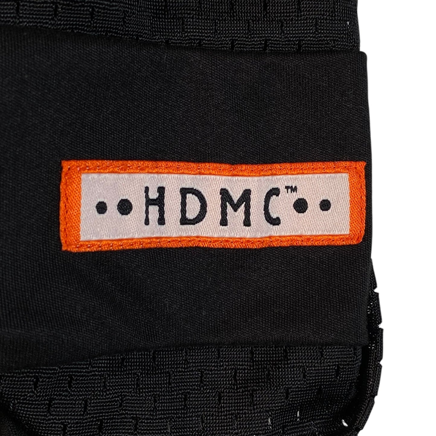 Digg It Thrift & Vintage black mesh football jersey featuring an orange and white HDMC logo patch