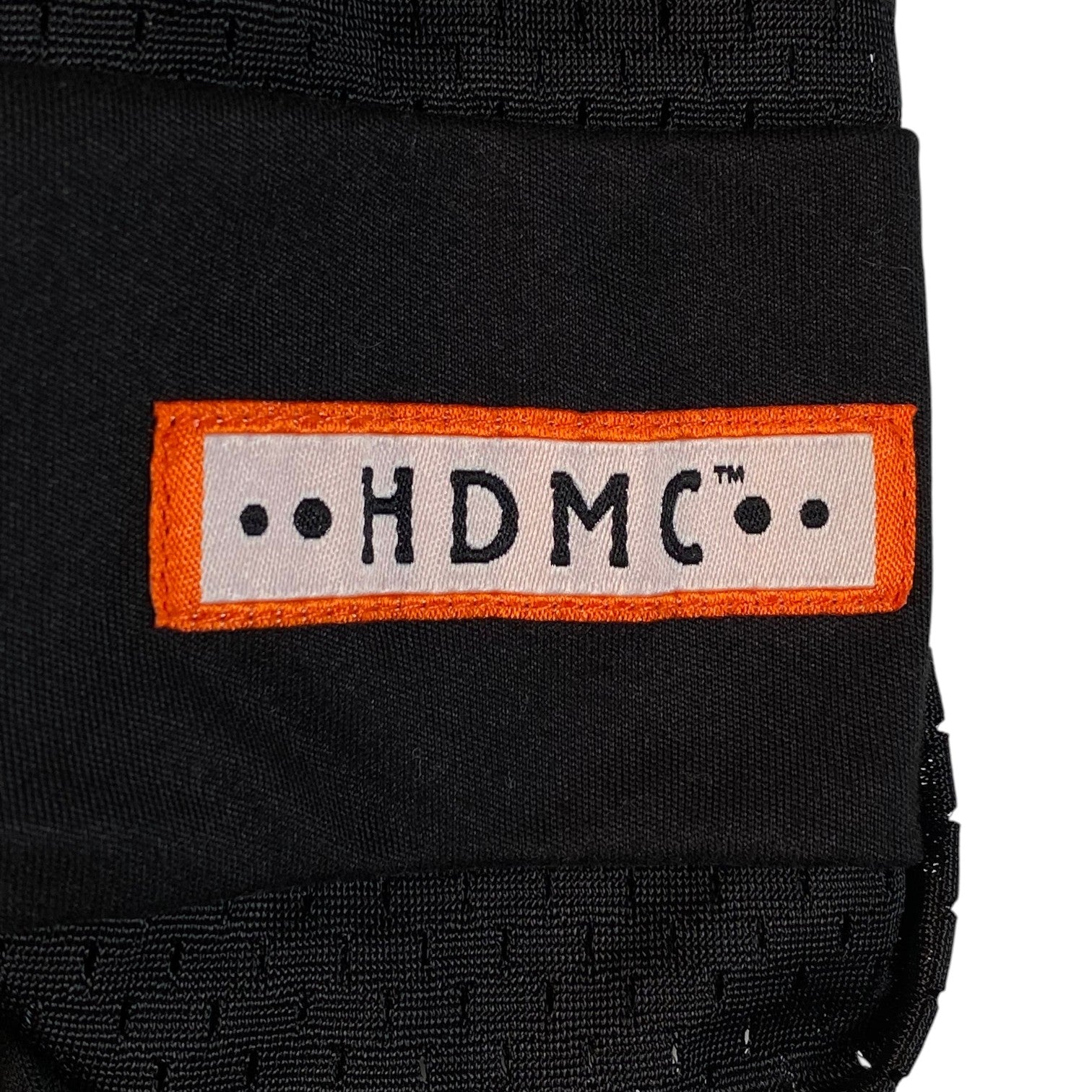 Digg It Thrift & Vintage black mesh football jersey featuring an orange and white HDMC logo patch